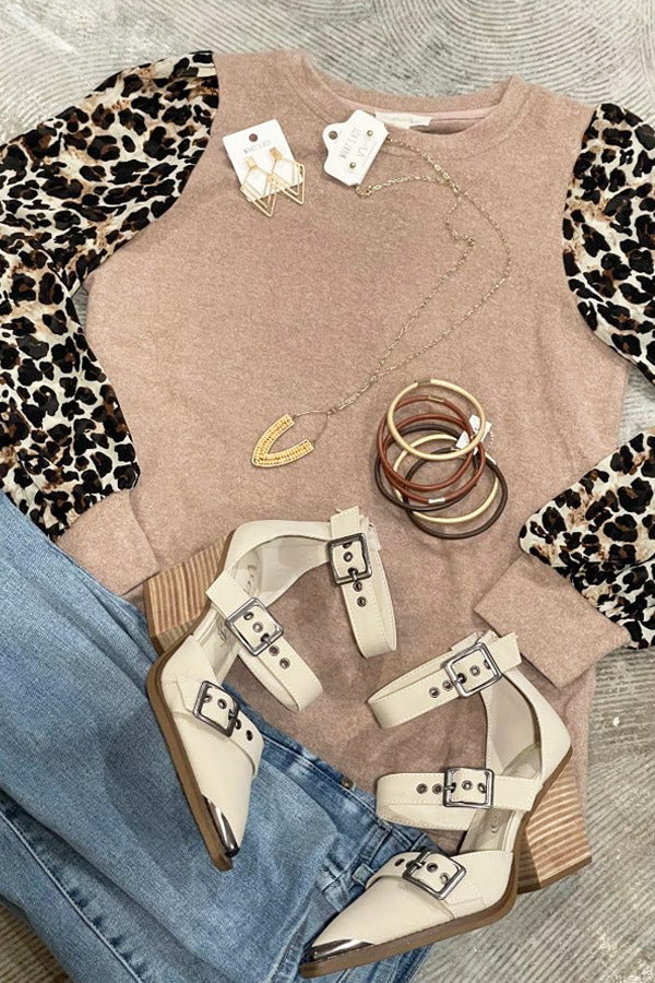 Leopard Gathered Sleeve Hi Lo Blouse Simply stylish blouse with classic leopard gathered sleeves, and a soft knit body... 100% polyester, sizing is S/M and M/L, so it depends on how you want it to fit. But either way, it will be one of your favorites! Note - this is for the sweater only, the fabulous Irina shoes are available in our Shoe Category! Jewelry available in store only. Denim not available.