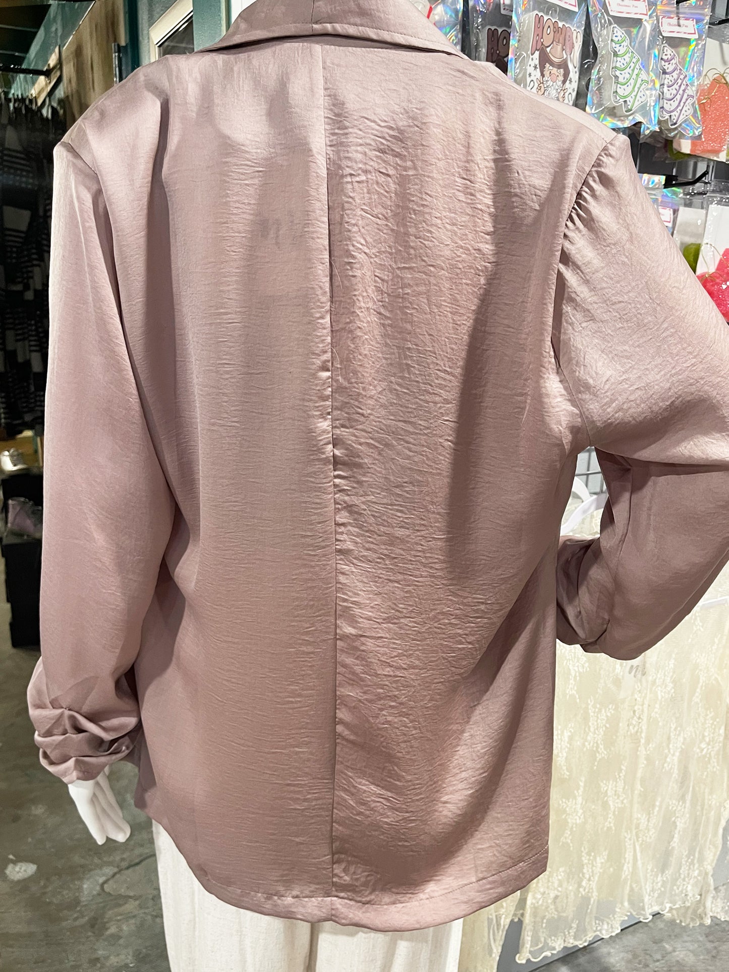 Cinch Sleeve Taupe Jacket Blazer by Kori This look expensive but looks are deceiving with this super stylish jacket! Pair it with your favorite bralette or blouse, you can't go wrong with the tailored style that is sleek and casual. The taupe color is champagne perfect. 100% polyester.