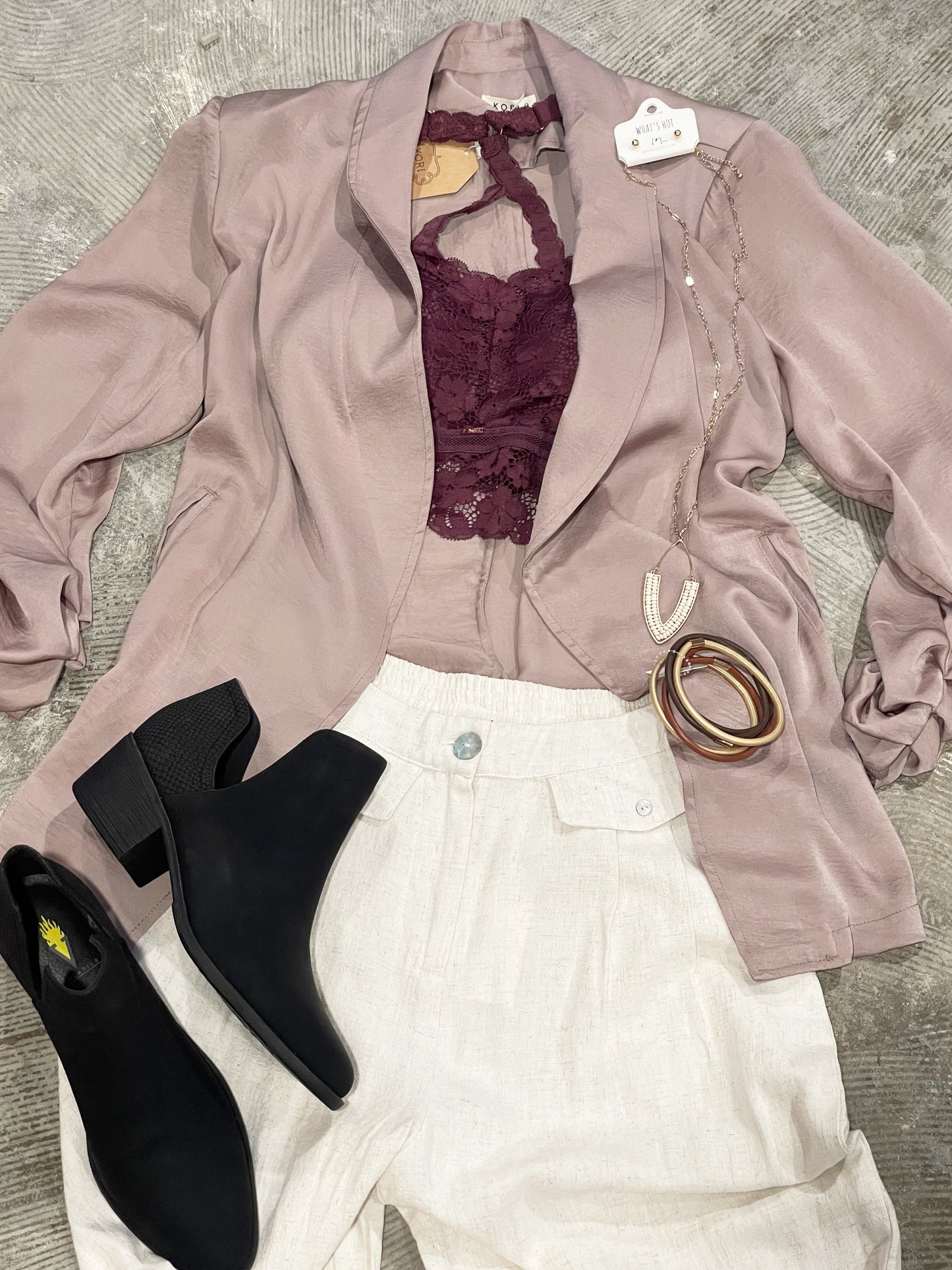 Cinch Sleeve Taupe Jacket Blazer by Kori This look expensive but looks are deceiving with this super stylish jacket! Pair it with your favorite bralette or blouse, you can't go wrong with the tailored style that is sleek and casual. The taupe color is champagne perfect. 100% polyester.