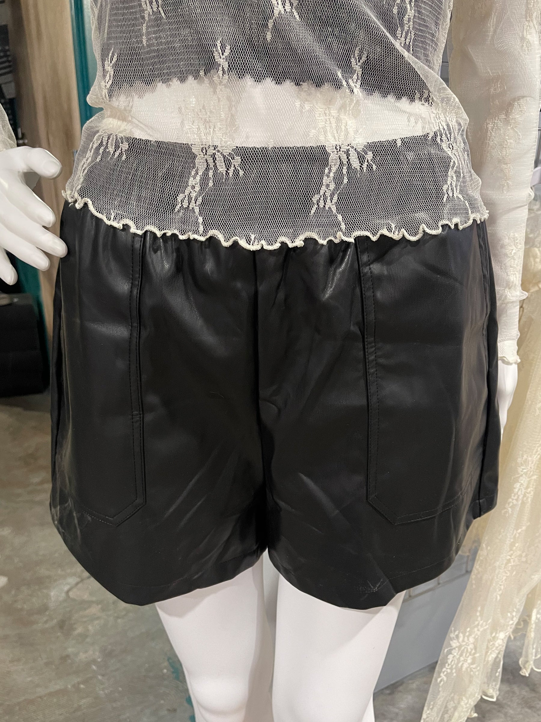 Fabulous can also be so comfy! Get these elastic waste, black faux leather shorts from Cotton Bleu... the go to for all your edgy but classic looks! 50% PU / 50% Polyester.