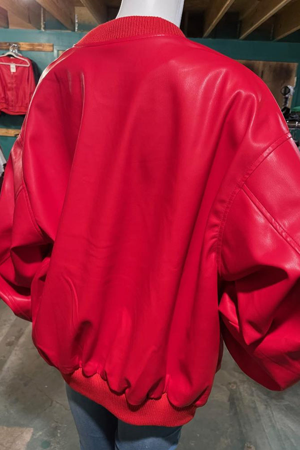 Faux Leather Retro Boyfriend Jacket in Red So cool and trendy! Nothing flatters better than an oversized jacket, and this one doesn't disappoint! Super generous fit with roomy, blousey sleeves, 97% polyester/3% spandex. The color is bright hot red, perfect for so many looks. Size down for a more traditional look, or go with the oversized fit and order your regular size.