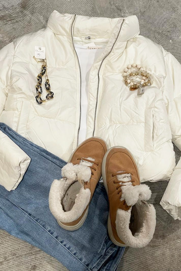 Cream Puffer Jacket, Modest Crop So cool and trendy! This jacket is ridiculously cute on! Pretty cream color, zipper front, very modestly cropped. 75% polyester, 25% nylon. Will keep you warm and stylish at the same time!