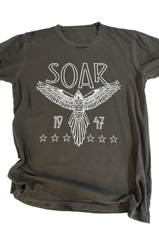 A destroyed tee in black with the word 'SOAR' written across the front, featuring a graphic of an eagle and stars above the text.