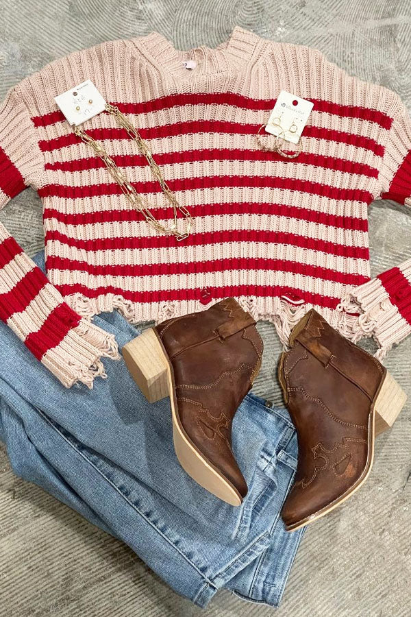 Striped Crop Sweater Distressed You will love this distressed, high crop striped knit sweater... layer it with a coverlet or bare the belly, either way it's fashion forward. Ragged in all the right places, red and tan stripes, 100% cotton. True to size. Note - this is for the sweater only, the fabulous boots are available in our Shoe Category! Jewelry available in store only. Denim not available.