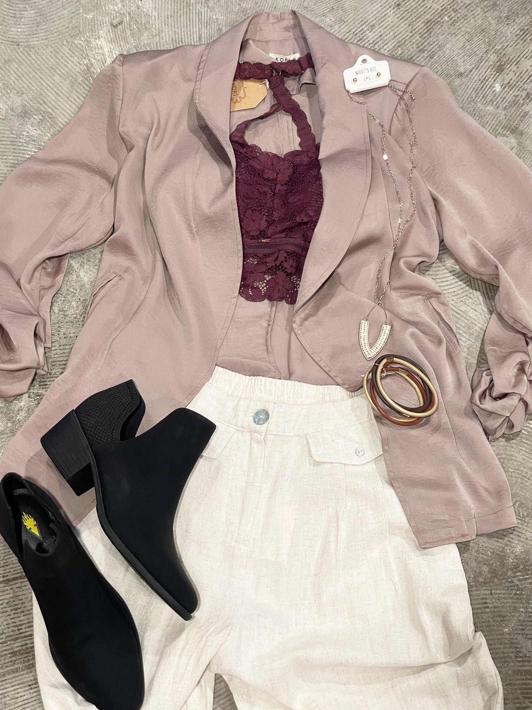 Cinch Sleeve Taupe Jacket Blazer by Kori This look expensive but looks are deceiving with this super stylish jacket! Pair it with your favorite bralette or blouse, you can't go wrong with the tailored style that is sleek and casual. The taupe color is champagne perfect. 100%  polyester.