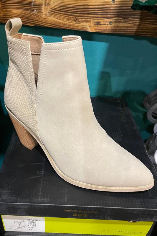 The perfect bootie is here! You will wear these Very Volatile faux suede booties with almost everything. Sweet chalk cream faux suede with a textured heel, deep set on the sides for style that is easy off and on. grab this closet staple today!