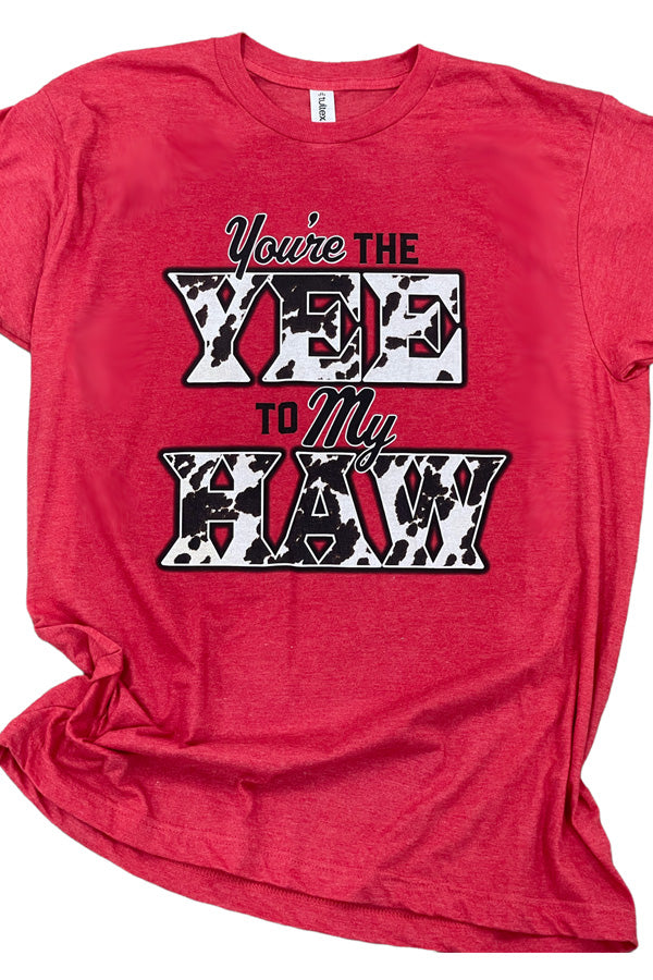 Yee To My Haw Tee Shown on the super soft heather red, this fun cowprint graphic is great for rodeo day or anyday! Tultex ringspun cotton/poly soft tee. Unisex relaxed fit. 